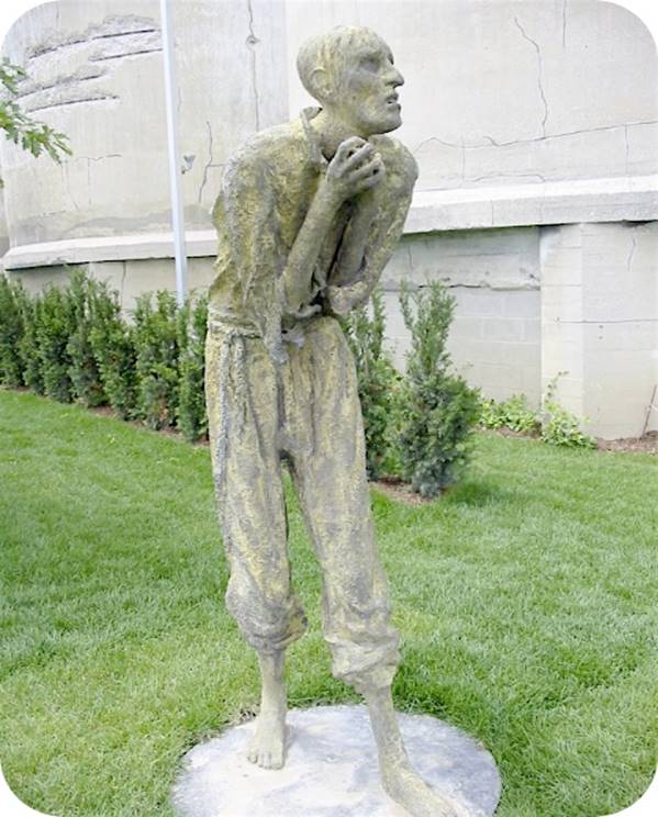 A statue of a person holding a baby

Description automatically generated with low confidence